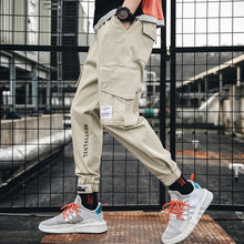Load image into Gallery viewer, Cargo Pants Joggers Men Black Harem Pants Multi-pocket Ribbons Man Sweatpants Streetwear Casual Pants Elastic waist Male Trouser
